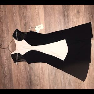 NEVER WORN. Flattering black/white dress w/mesh